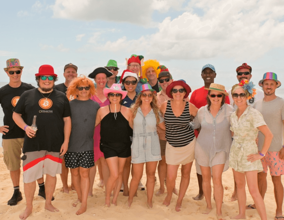 Collective members together on the beach