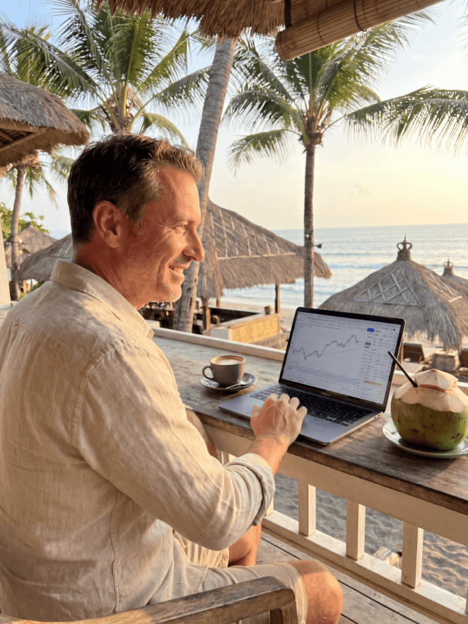 Greg Cassar reviewing AI tech stock charts — investing coach for Australian business owners